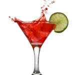 Red cocktail with splash and lime isolated on white